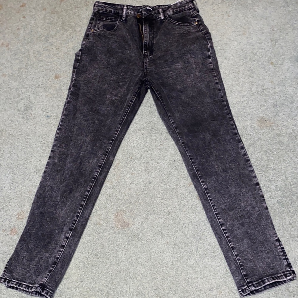 Black high waisted jeans paired with jacket translucent leather jacket